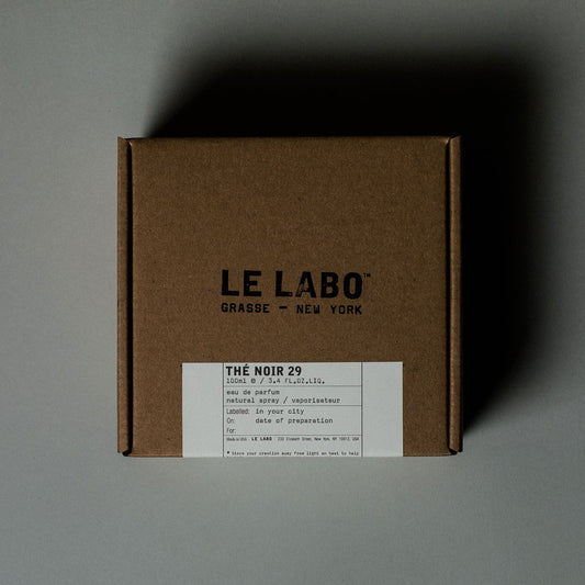 Brown box with 'Le Labo' branding on a gray background