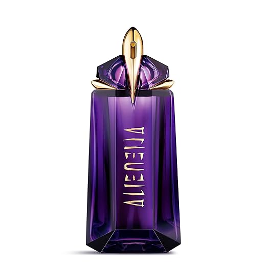 Purple perfume bottle with gold cap on a white background