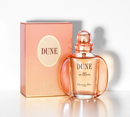 Dior Dune perfume bottle and packaging on a white background