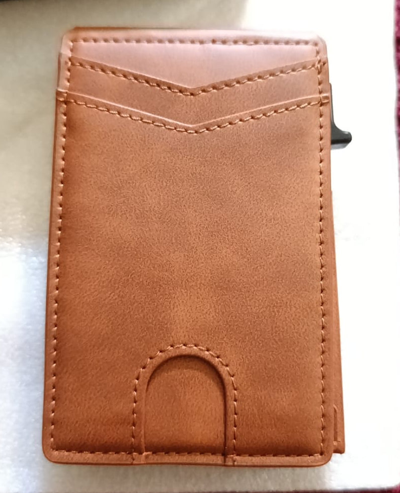 Brown leather wallet on a striped fabric background