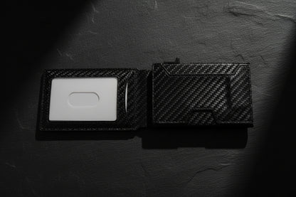 Black carbon fiber wallet on a white background