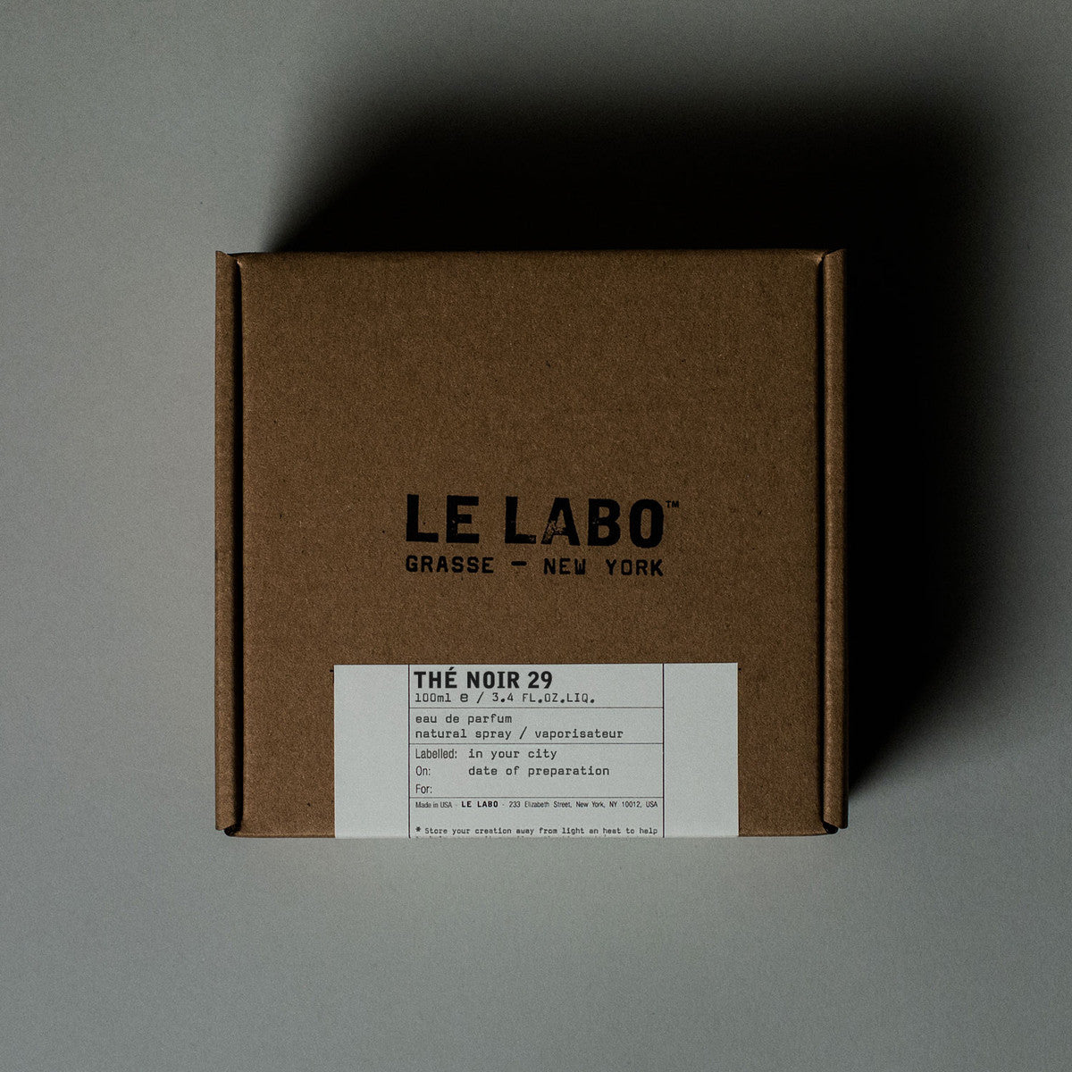 Brown box with 'Le Labo' branding on a gray background