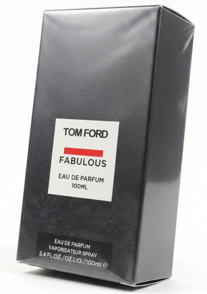 Tom Ford Fabulous perfume box held by a hand against a red background