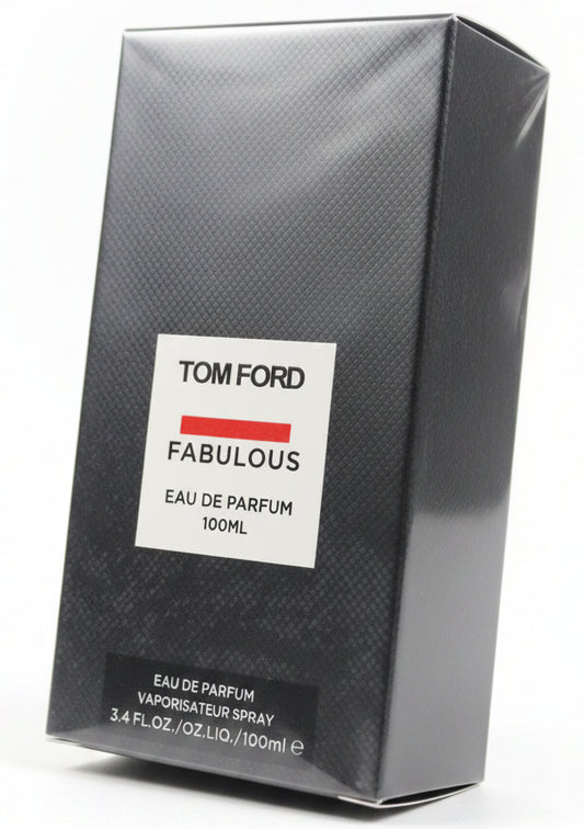 Tom Ford Fabulous perfume box held by a hand against a red background