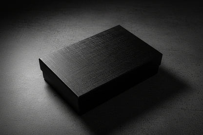 Black textured box on a white surface